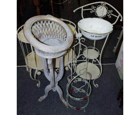 A wrought iron and tubular steel washstand with enamel basin; a wrought iron two tier shelving unit; three wall hangers; a wi