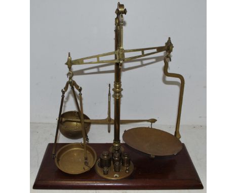 A Victorian Cooperative Wholesale Society Limited balance scale and weights, mahogany base, Balloon Street Manchester