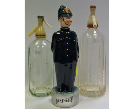 A King George V Ellis soda syphon;  another, Schweppes;  a novelty decanter, A Fair Cop (3)