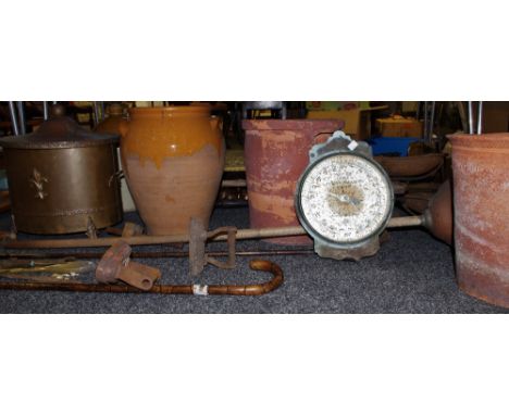 An early 20th century copper fuel bin applied with fleur de lys motif; a 20 lb Salters trade spring balance No.77T scale; ear