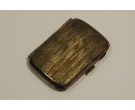 A George V silver rounded rectangular cigarette case, engine turned, Birmingham 1932