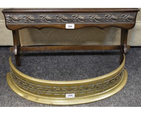 A late 19th century pierced brass fender; a wall shelf (2)