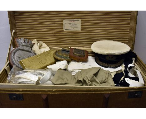 A large collection of Naval uniform items, to include a peak cap with bullion badge, epaulettes, collars, cuffs, gloves, shir
