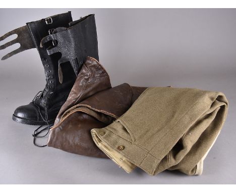 A collection of Dispatch Rider's uniform items, comprising a brown leather waistcoat, no.2 camouflage, dated 1944, a pair of 