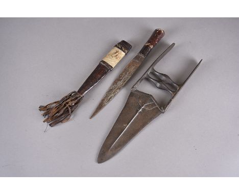 An Indian Katar knife, having 17cm long triangular blade, together with a African knife and scabbard (3) 