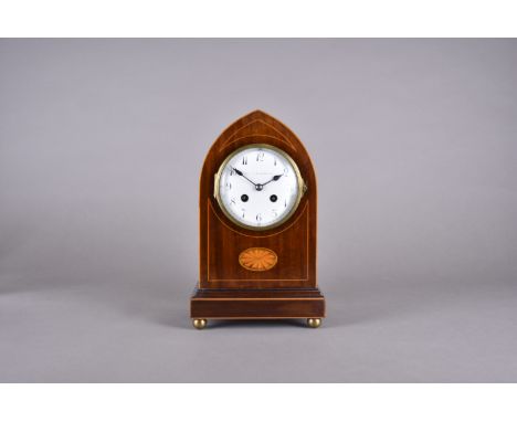 An Edwardian Mappin & Webb Ltd mahogany and satin strung arched mantle clock, enamel white face, Arabic numerals, sphere gilt