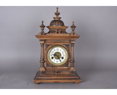 A 19th Century walnut mantel clock, by W E Watts, Nottingham, titled The Greenwich Clock. Key present and clock functioning a
