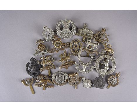 A collection of WWI and later British and Overseas cap badges, including Brecknockshire Territorial, Lancashire Fusiliers, Sc