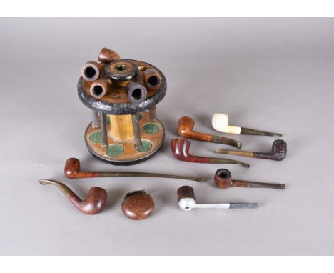 A collection of London made briar smoking pipes, including straight and bent examples, all having vulcanite stems, together w