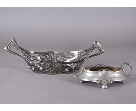 An Art Nouveau silver plated pewter based planter, decorated with pierced sinuous and whiplash handles, cherry branch design,