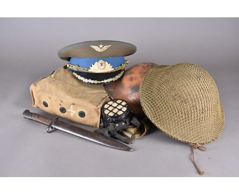 An RO &amp; Co steel brodie helmet, together with another steel and a plastic example, plus three Russian hats, a WWII gas ma