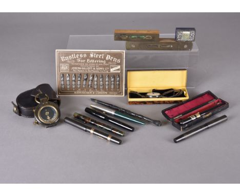 A small collection of Art Deco and later fountain pens, including a cased example titled 'The Neptune Fountain Pen'; a black 