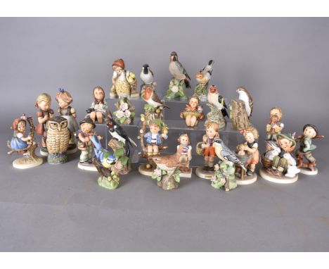 A collection of Goebel and Hummel figurines, together with a collection of bird figures 