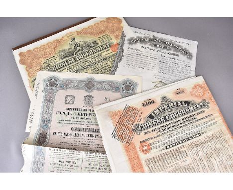 A collection of Russian share bonds, together with Italian examples, various Chinese government examples previously folded, a