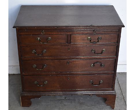 A 19th Century oak bachelor's chest, brushing slide above two short and three graduated long drawers, bracket feet, 86 cm wid