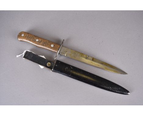 A WWII German Luftwaffe fighting dagger, the well oiled 16.5cm long blade marked with a 6 in German eagle, single piece oval 