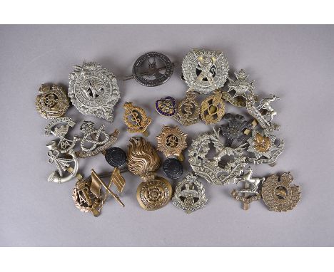 An assortment of WWI and later cap badges, to include London Scottish South Africa 1900-02, Notts &amp; Derby Sherwood Forest