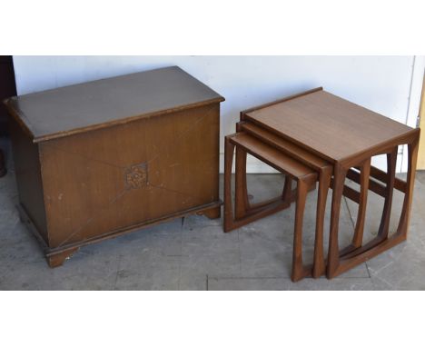 A nest of three G-Plan oak tables, largest 53 cm wide x 43 cm deep x 49 cm high, smallest 43 cm wide x 35 cm deep x 42.5 cm h