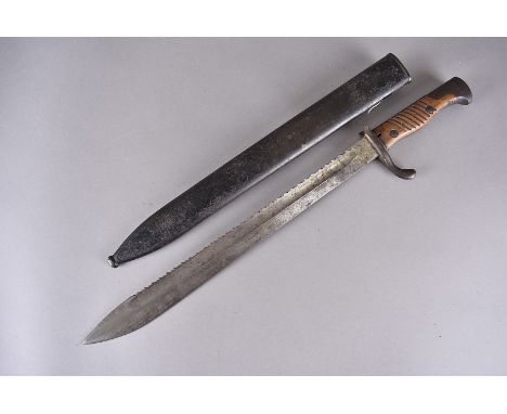 A WWI German Saw Back bayonet, by Erfurt, marked with the crown, the 37cm long blade with serrated back, having wooden grip, 