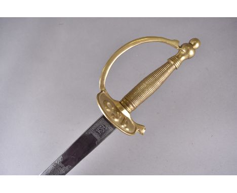 An American CSA Sword, having CSA to the hand guard, decoratively engraved blade, also marked CSA, in metal scabbard Possibly