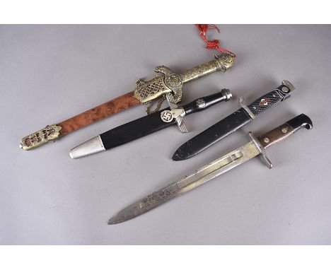 A German Waffenfabrik Neuhausen bayonet, together with a reproduction Hitler Youth knife with scabbard, plus two other reprod