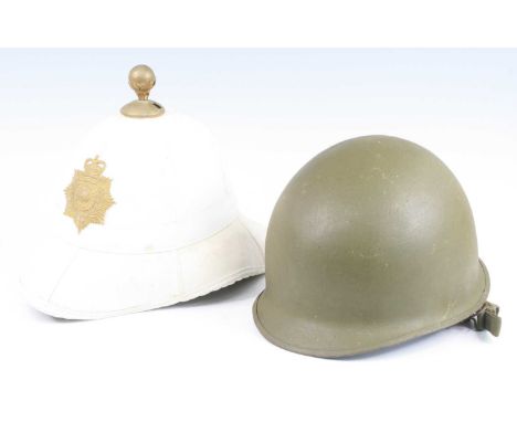 A Royal Marines dress helmet, having a brass ball finial above a pressed brass plate, the leather liner inscribed Cromwell, b