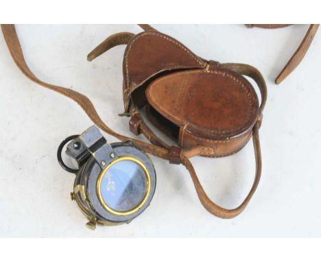 A WW I Verners pattern MK VIII prismatic compass, the case back marked F-L No. 74143 and dated 1917, housed in a brown leathe