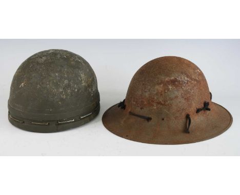 A WW II British Dispatch Rider's helmet, of green painted fibre construction, the rim with twin ribs and cord fastening with 