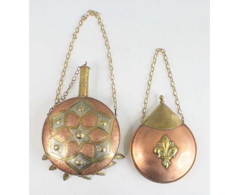 An Ottoman brass powder flask, of compressed circular form with applied copper and nickel panels, 26 x 17cm, together with on