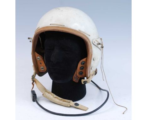 United States Air Force Type P-1A Protective Flying Helmet, the white fiberglass shell with leather strap webbing, brown rubb