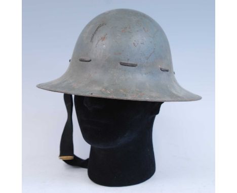 A WW II Zuckerman steel helmet, in grey finish with lace banding, the leather liner marked BMB (Briggs Motor Bodies of Dagenh