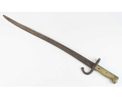 A French model 1866 chassepot bayonet, having a 57cm fullered yataghan shaped steel blade with hooked quillon and ribbed bras