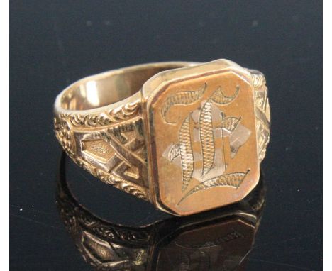 A gentleman's yellow metal ring (tests as approximately 14k) with engraved monogram, size V/W, accompanyed by a certificate f