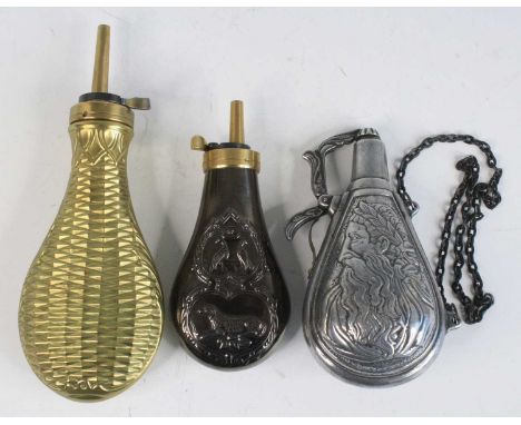 An Italian brass powder flask, of typical pear shape with raised lozenge and acanthus leaf decoration, 22cm, together with on