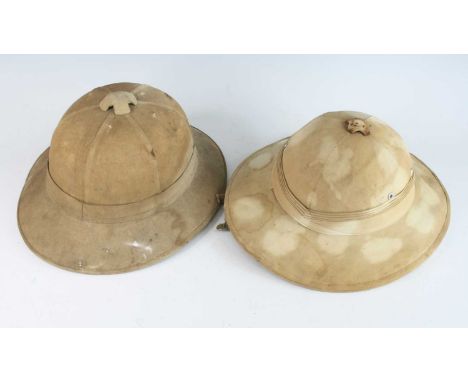 A WW II Foreign Service Wolseley pattern pith helmet of six panel cork construction with leather lining, together with one ot