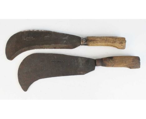 A WWII billhook having a 26cm curved steel blade impressed A&amp;FR dated 1942 with broad arrow having turned wooden handle, 