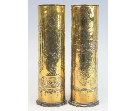 A pair of WW I German artillery shells, each inlaid with copper and white metal with further engraved decoration and Arabic s