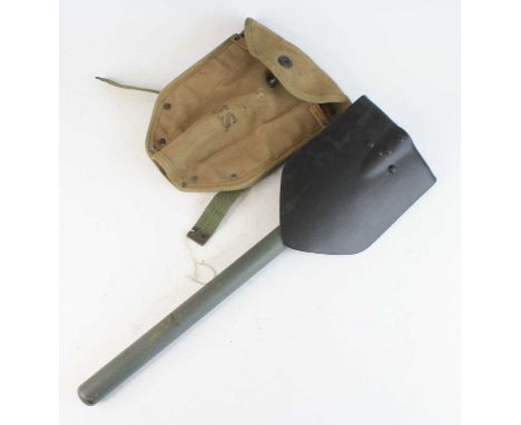 A post WW II U.S. Army entrenching tool, in an associated canvas sleeve dated 1943, 50cm.