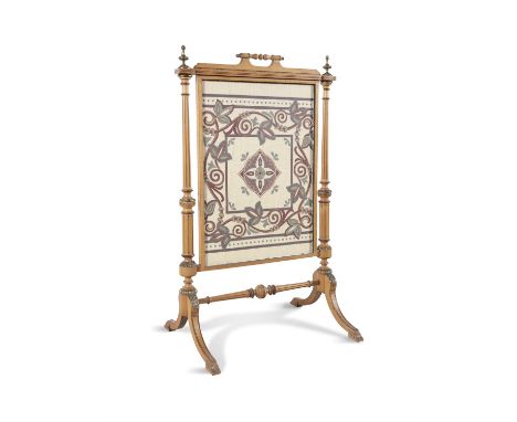 A SATINWOOD AND BRASS MOUNTED FIRE SCREEN,the needlework panel contained within rectangular frame, surmounted with turned han