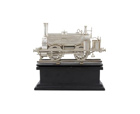 AN EDWARDIAN SILVER MODEL OF A STEAM LOCOMOTIVE ENGINEBirmingham, c.1911, mark of Elkington & Co., the train dated 1857, with