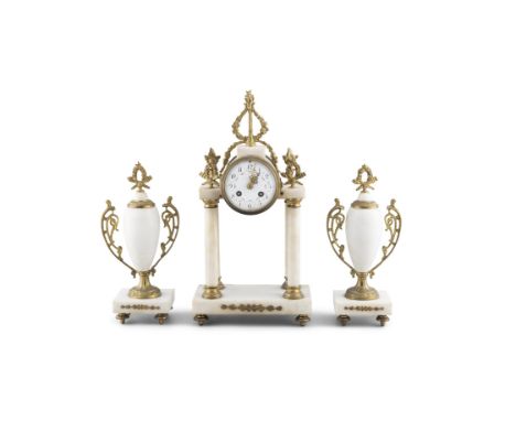 A 19TH CENTURY FRENCH WHITE MARBLE AND GILT METAL MANTLE CLOCK,the cylinder movement with painted enamel dial raised on a tem