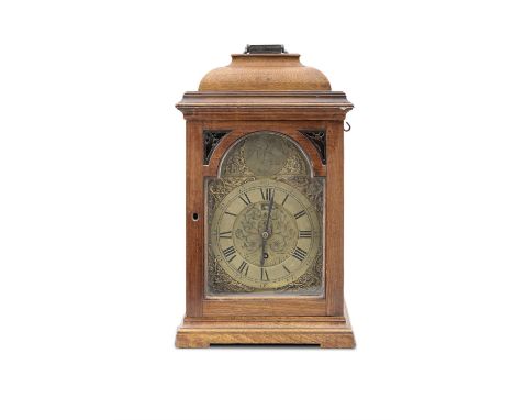 A GEORGE III OAK CASED BRACKET CLOCK, BY THOMAS BROWN OF CHESTER,the stepped domed case with arched glazed door, enclosing a 