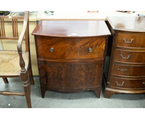 A NINETEENTH CENTURY CONVERTED BOW FRONT MAHOGANY COMMODE 