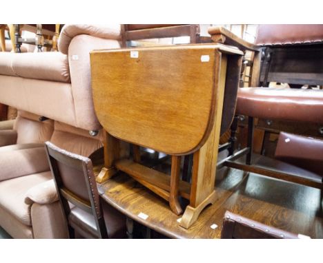 TWENTIETH CENTURY OAK SUTHERLAND TABLE; A POUFFE ON CABRIOLE SUPPORTS, AND A SMALL OAK STOOL WITH WICKER TOP AND ANOTHER (4) 