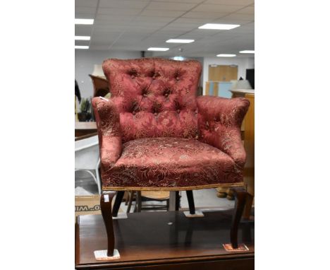 An early 20th Century button back tub chair
