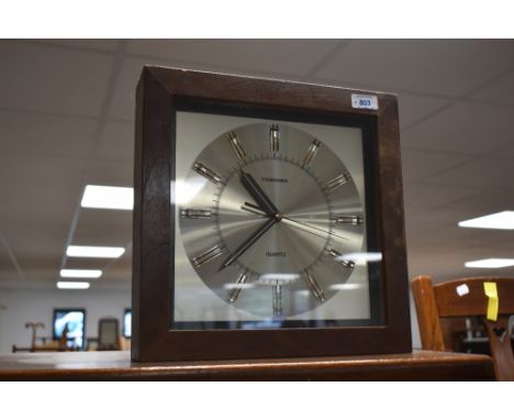 A vintage Toshiba battery powered wall clock, approx. 31 x 31cm