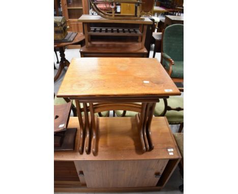 A vintage teak G plan or similar nest of three tables