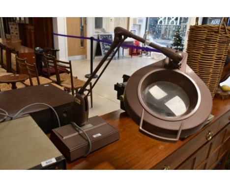 A vintage angle poise magnifying lamp, labelled for ICI
