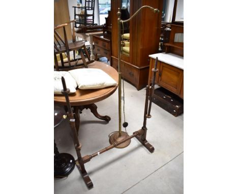 A traditional mahogany tapestry stand having turned frame