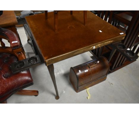 A vintage card table having folding mechanism with pop out bakelite drink/ash/money trays